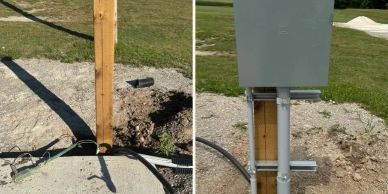 Electrical post installation in progress outdoors.