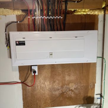 Electrical panel installed on wood.