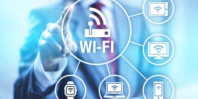 Wi-Fi image with transparent display of man pointing at connected devices