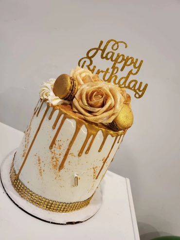 Custom Made 6 inches cookies n cream cake. with hand painted gold roses and macarons.