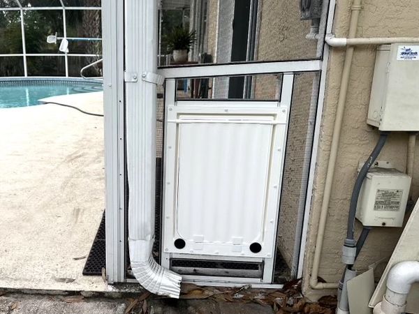 Doggy door installation by Re-screen Renovations