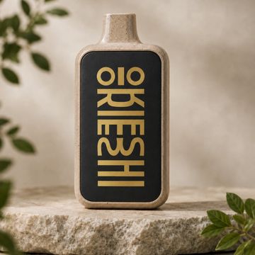 A modern rectangular ceramic vase with bold typography on stone.