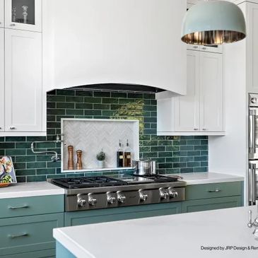 dark blue and green backsplash in a modern kitchen with white and green cabinetry