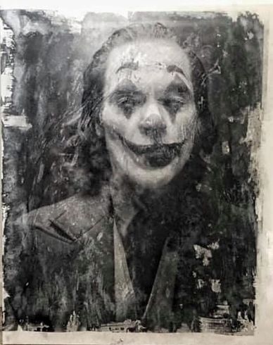 Black and white portrait of a person in Joker makeup with a distressed texture.