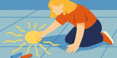 Child drawing a bright sun on the floor with chalk.