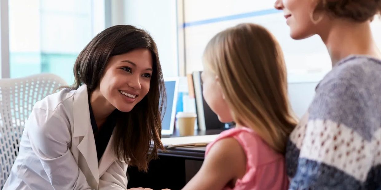 Counselor with child and guardian