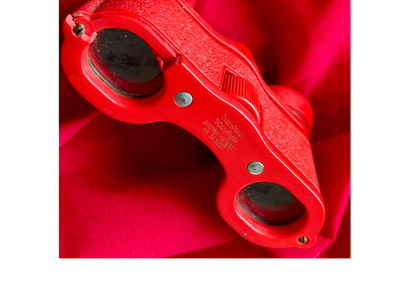 Opera glasses used by Eve Montgomery to create theatre caricatures for The Star newspaper in London