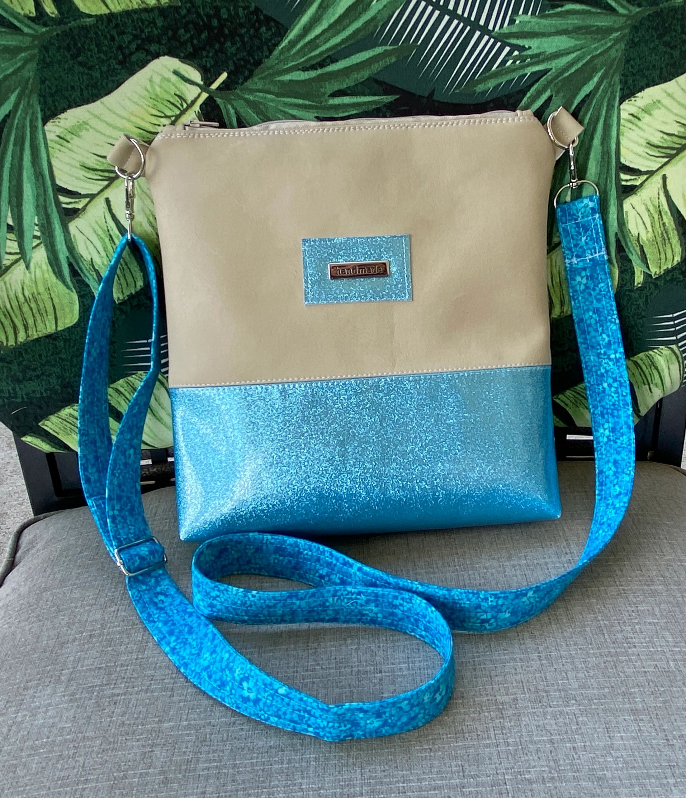 Handmade tan vegan leather and blue glitter vinyl fabric zipper top purse with long shoulder strap