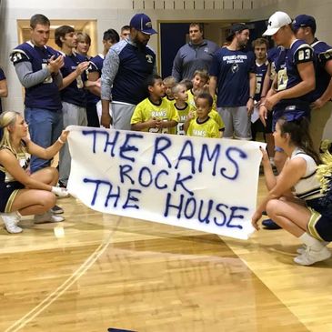 Spring-Ford Youth Football & Cheer flag players at the annual pep rally about to run out onto the co