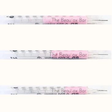 Three pregnancy tests showing positive results with 'The Beau ox Bar' label.
