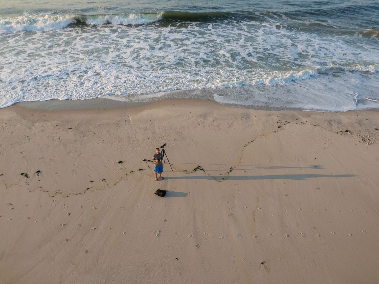 Aerial photo of Rob at Lido Beach, shooting surfing