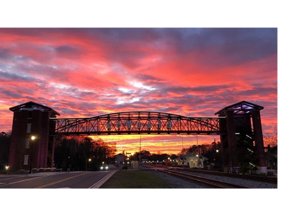 Beautiful sunset over Acworth, Georgia Pedestrian Bridge that runs over downtown train tracks. 