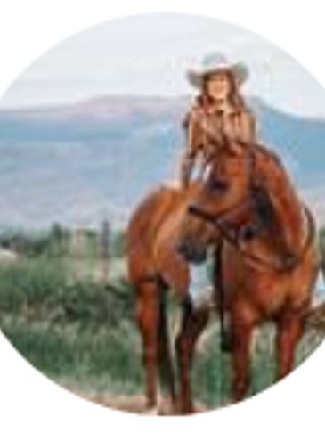 A woman in a cowboy hat riding a brown horse outdoors.