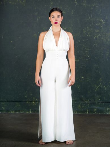 White halter neck wedding jumpsuit with wide leg trousers and splits on the sides.