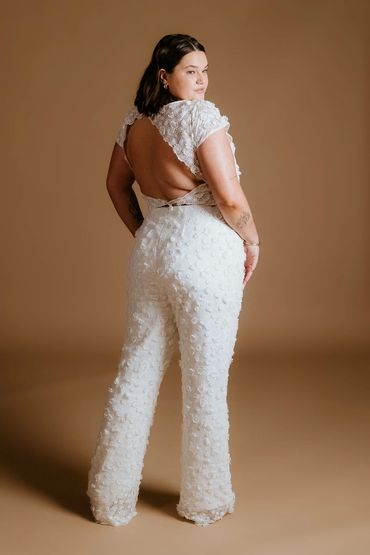 Plus size wedding outfit.
Open back top with a matching flared trousers made with 3D floral lace.