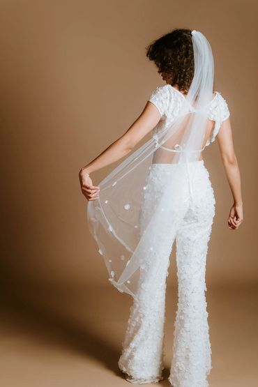 Cool bridal separates; floral crop top and flared trousers, with a matching single tier floral veil.