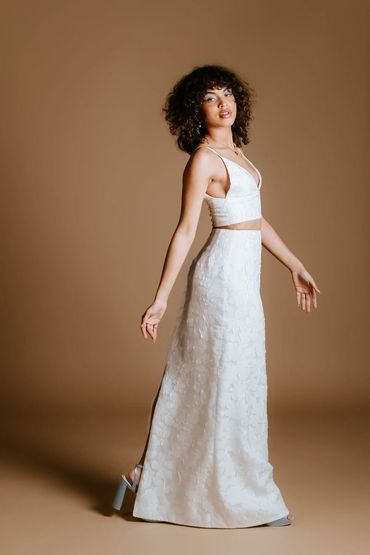 Floral embossed bridal separates. Top with low v neckline and a maxi skirt in ivory to match.