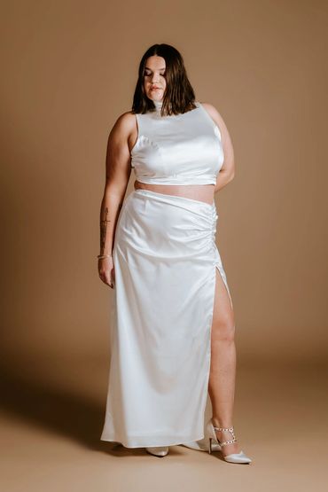 Plus size bridal outfit, elegant silk satin crop top and show stopping skirt with slit and train.