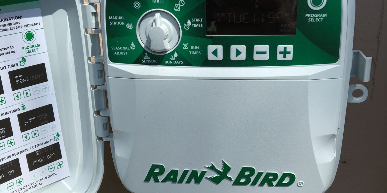 Rain Bird irrigation controller with settings panel.