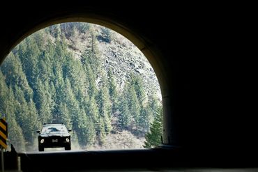 Aston Martin DBX driving through Hell’s Gate tunnel along the Fraser Valley Canyon. 