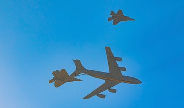 KC-135 refuelling F-22 Raptor over Edwards AFB. F-35 on the wing. 