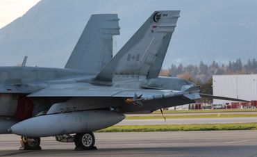 Tail of RCAF CF-18B Hornet on the South ramp at YVR. From 410 Cougar Squadron. 