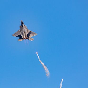 F-22 Raptor releasing flares during Aviation Nation 2022 at Nellis AFB.