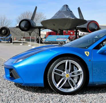 Ferrari 488 spider in blu corsa livery parked between the most famous spy plane the SR71 Blackbird. 