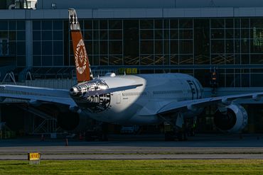 Fiji Airways Airbus A350 parked at the gate at Vancouver International Airport.