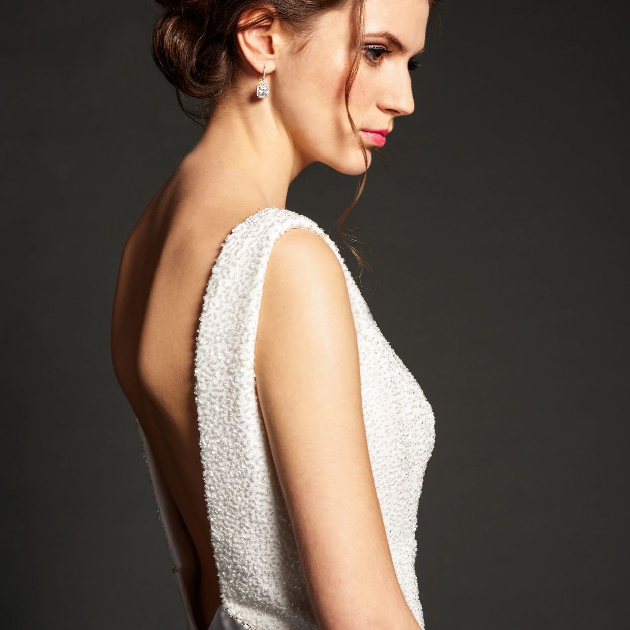 Low open back beaded wedding dress with fitted satin back crepe skirt