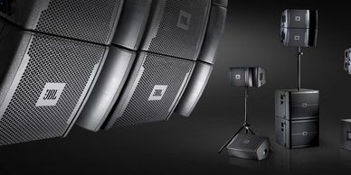 Professional JBL speakers and audio equipment arranged in a studio setup.