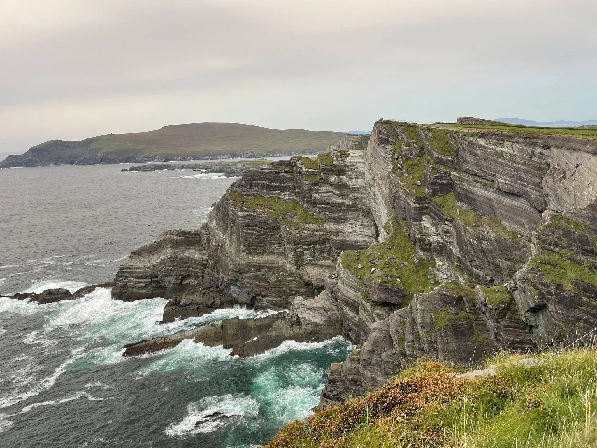 Scenic coastal cliffs and ocean waves photographed as professional nature and landscape photography.