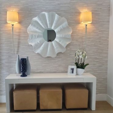White mirror over white console with 3 custom benched