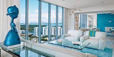 Turquoise and white room with a view and original art. 