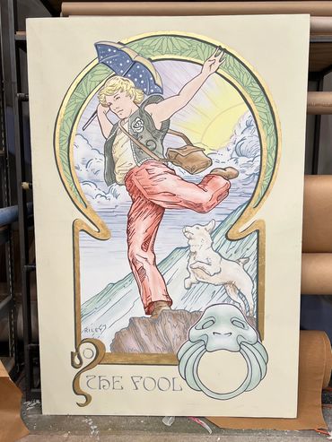 The Fool tarot card painted on a large canvas in a watery style with gold leaf detail.
