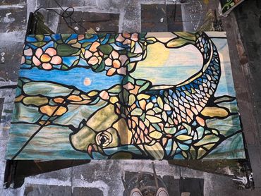 Stained glass painting on muslin with light shining through it.  Created with crystal gel and paint.