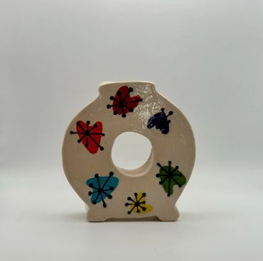 Ceramic vase with colorful abstract floral patterns.