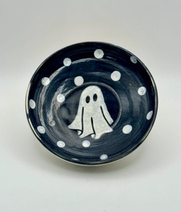 Black bowl with a white ghost and polka dots.