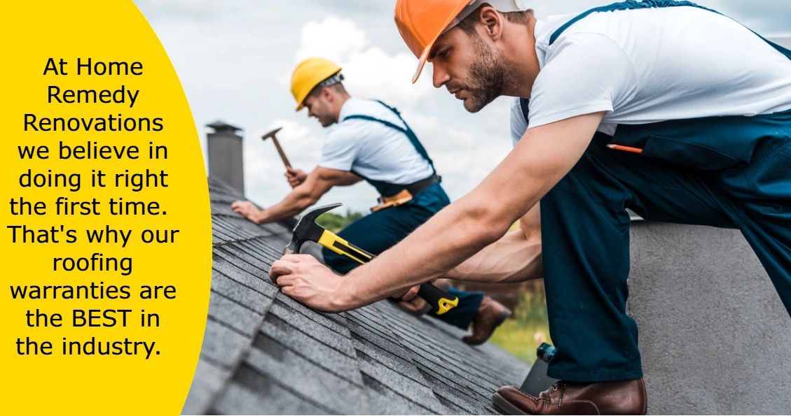 Two workers in helmets repairing a roof with hammers, emphasizing quality roofing warranties.