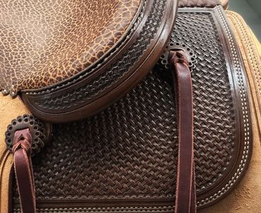Detailed close-up of textured leather with braided elements.