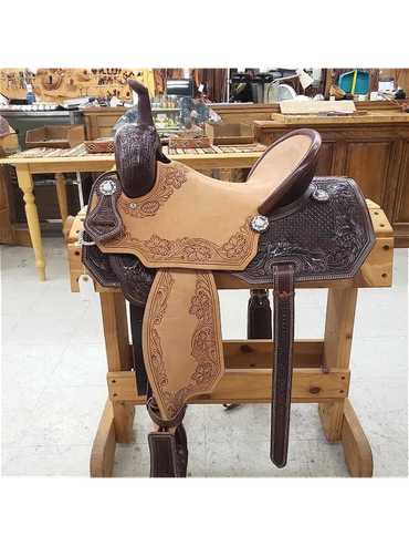 Detailed leather saddle on wooden stand.