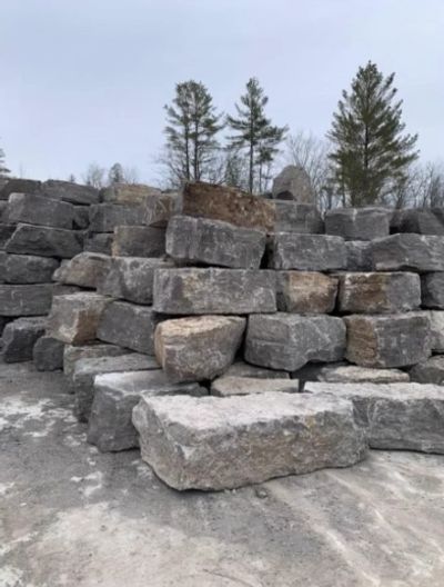 Armour stone pile, black armour, beige armour, natural stone, garden beds, decorative stone, armour