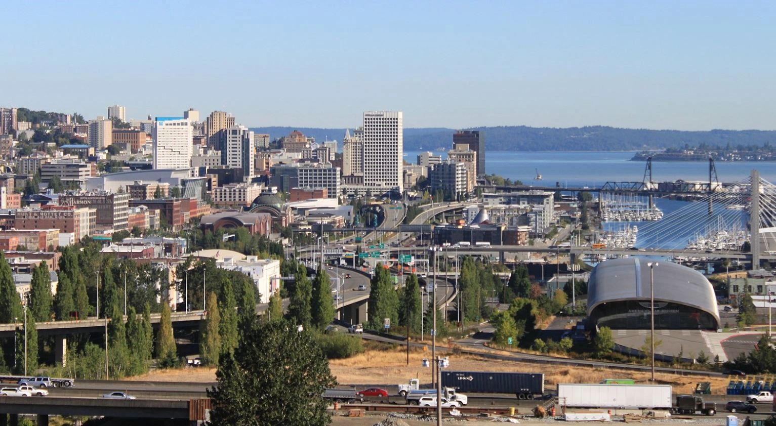An image of downtown Tacoma from the view looking out from I5 towards the water of the Puget Sound.
