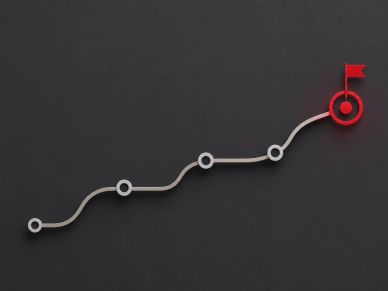 Graph line with milestones leading to a red target flag.