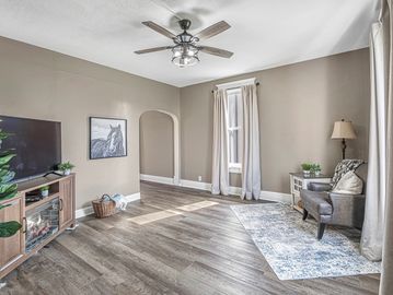 Cozy living room with neutral tones and natural light.