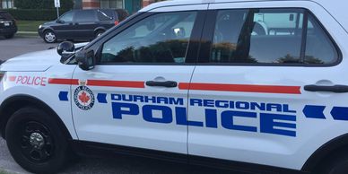 Durham Regional Police vehicle parked on a street.