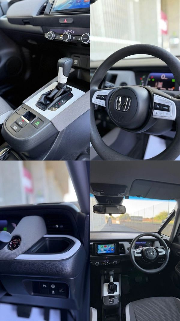 Interior shots of a modern Honda car showcasing the dashboard, steering wheel, and gear shift.