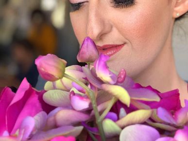 bride cosmetics smelling flowers