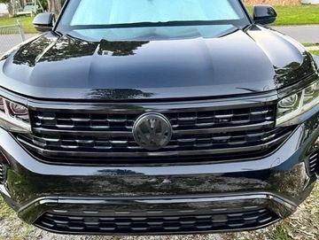 Front view of a shiny black Volkswagen SUV with sleek design.