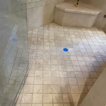 Re-grouting Shower Enclosure Floor in Henderson, NV. Marble Shower Floor re-grout.